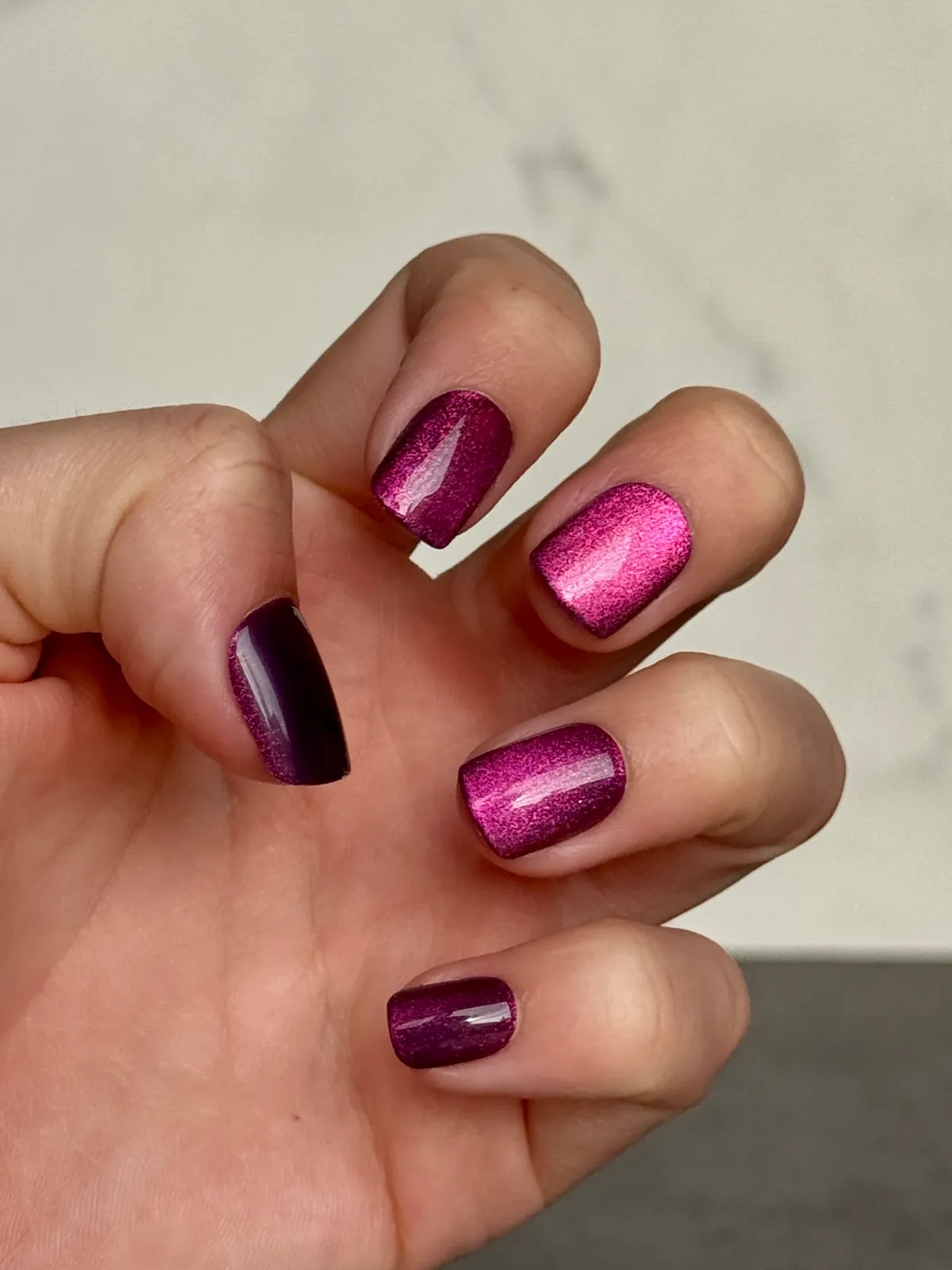 Close-up of magenta Dashing Diva press-on nails