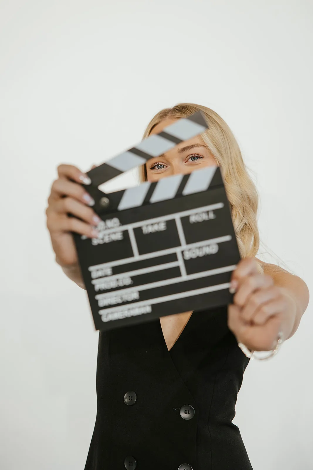 Savannah June holding a film clapperboard in the studio